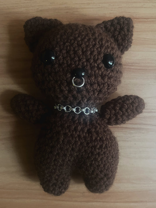 brown crochet cat with chain and piercing